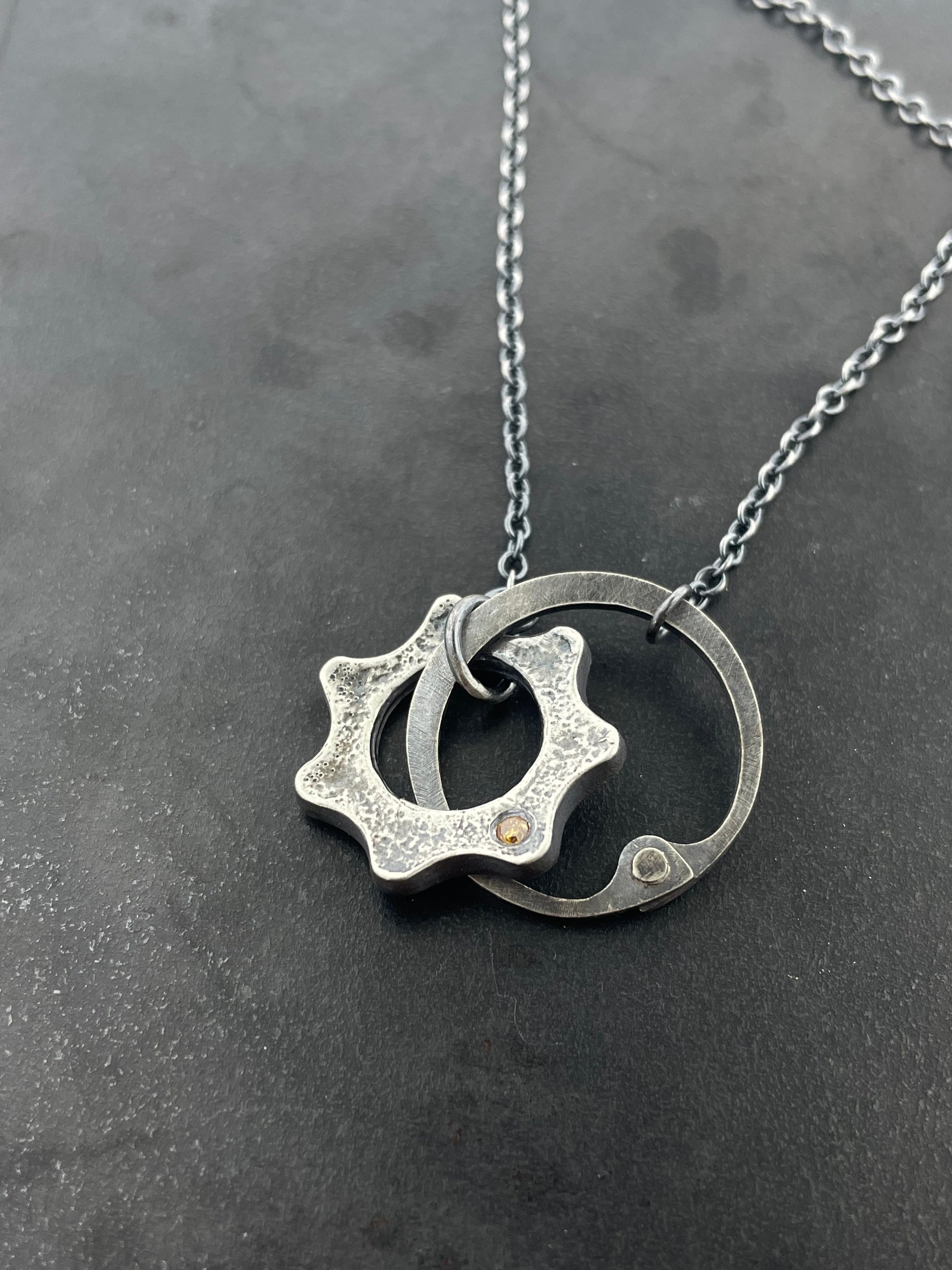 Clutch and Gear Necklace