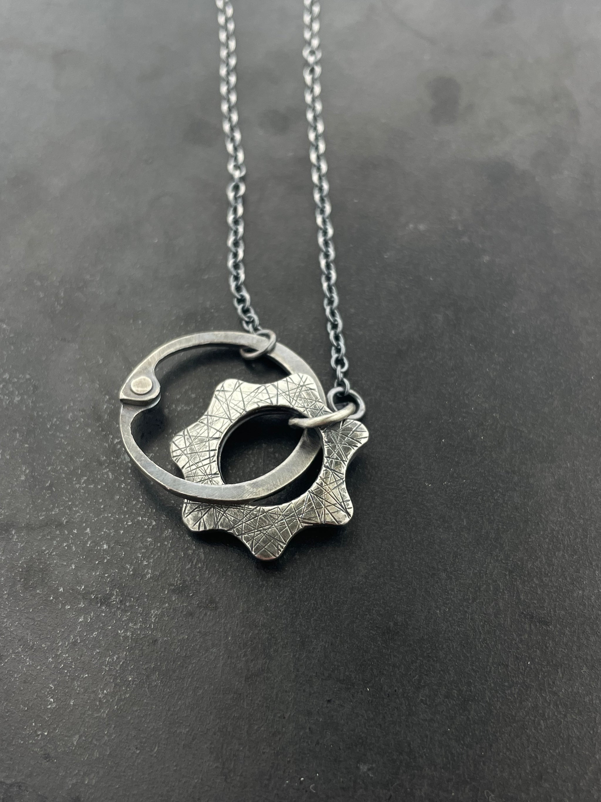 Clutch and Gear Necklace