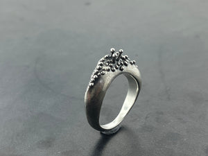 In Flow ring with knobbly  and scratch textures