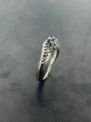 In Flow ring with knobbly  and scratch textures