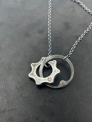 Clutch and Gear Necklace