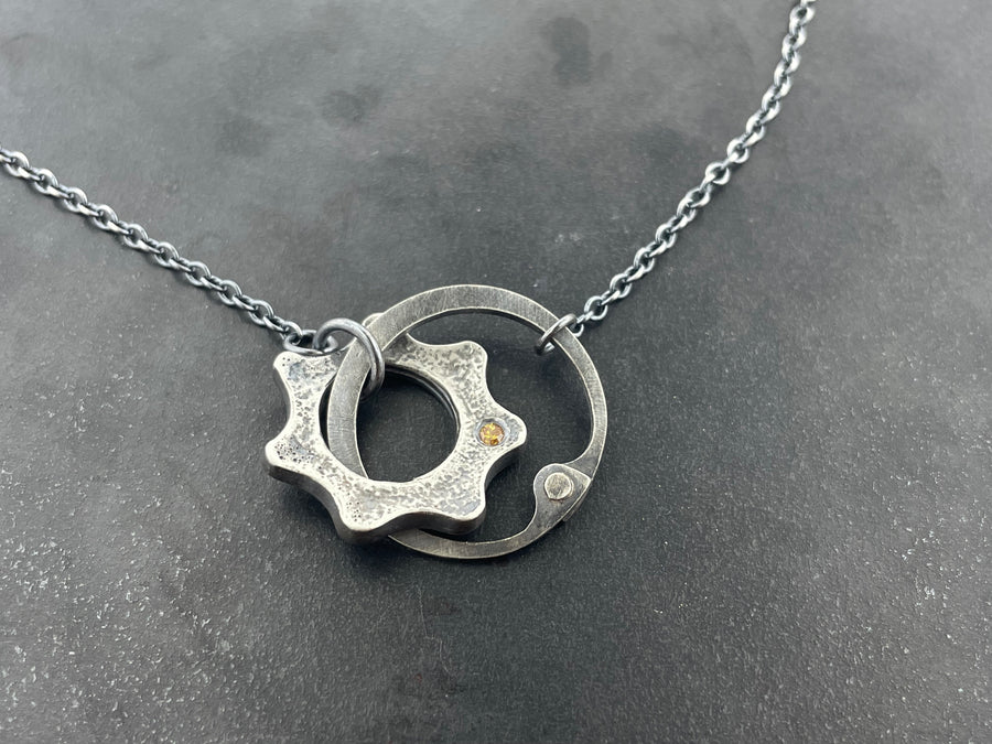 Clutch and Gear Necklace