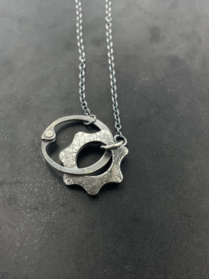 Clutch and Gear Necklace